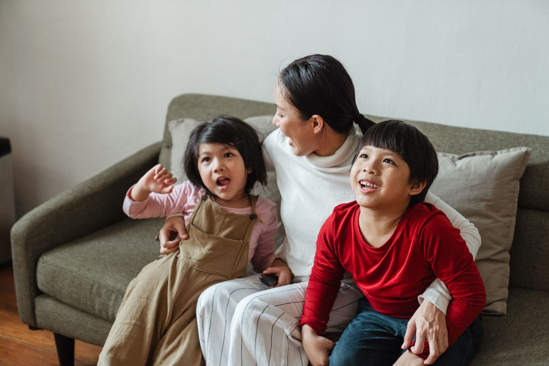 Asian mother and children spending time together at home